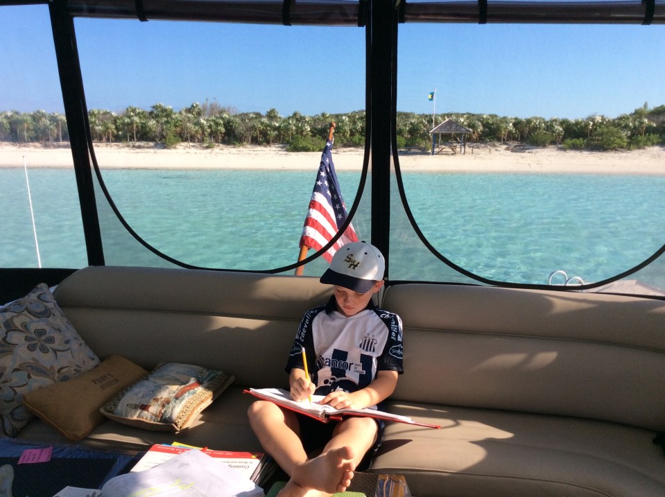 Ryan homeschooling on the bridge, Exuma Cays Land & Sea Park, Bahamas