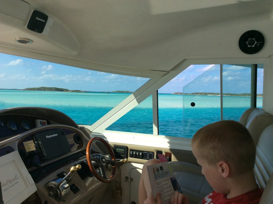 Ronan homeschooling on the bridge, Exuma Cays Land & Sea Park, Bahamas