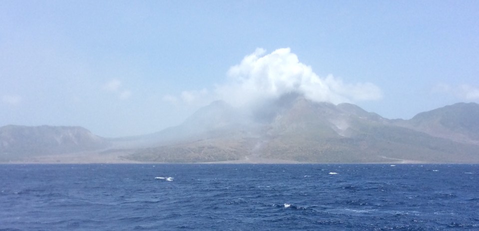 Montserrat active volcano, Plymouth rooftops on the bottom left