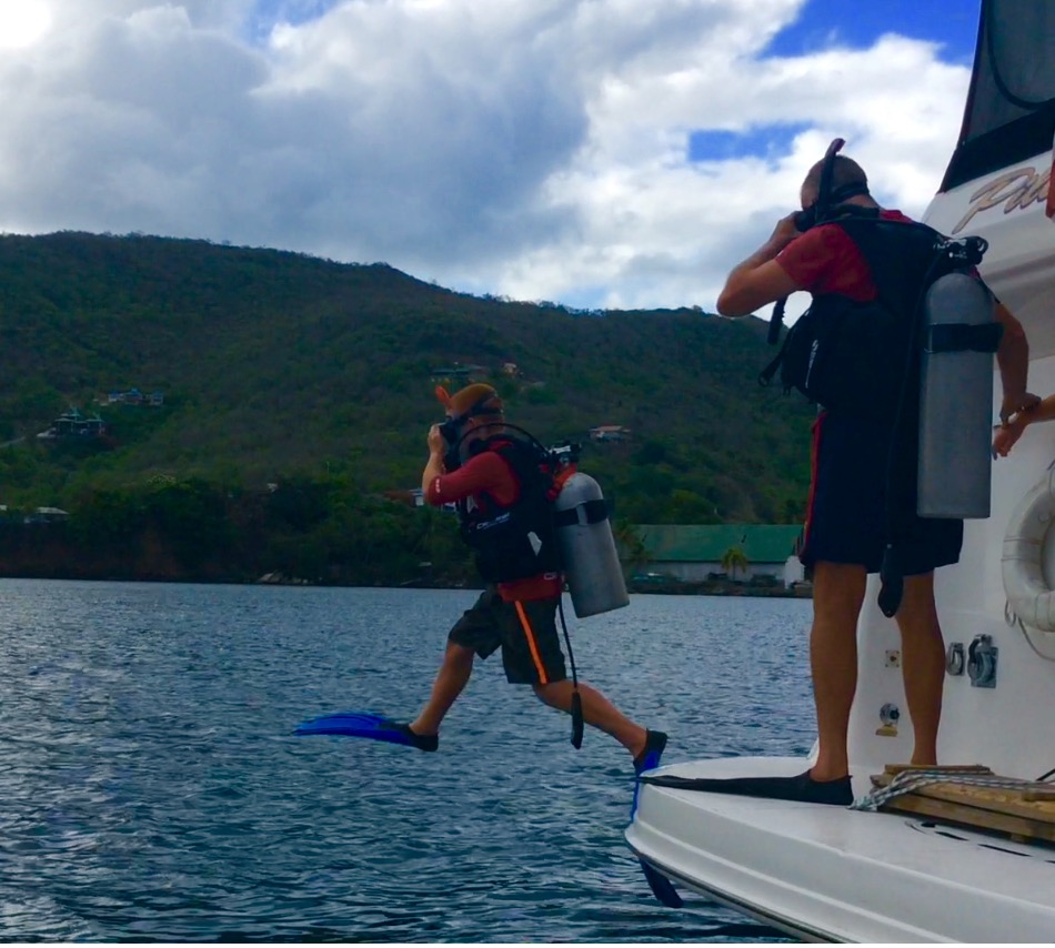 Ryan stepping in to dive the boat with Randy, Bequia