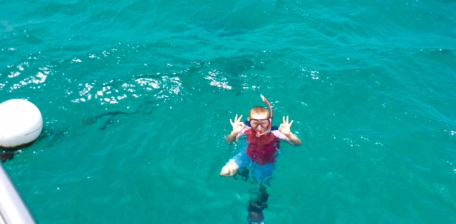 Ronan giving the 'OK' on the mooring ball, Baradol Island, Tobago Cays