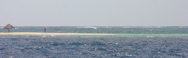 Thatched hut on sand bar entering cut between Petit St. Vincent & Petite Martinique