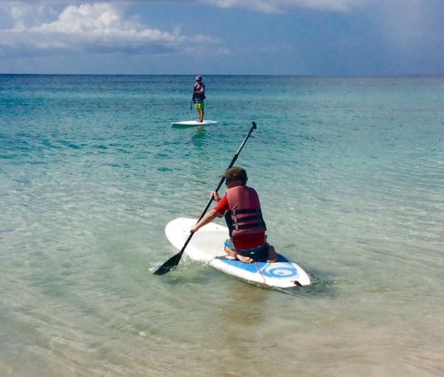 Ronan paddles out to join his brother, Mount Cinnamon, Grand Anse Beach, Grenada