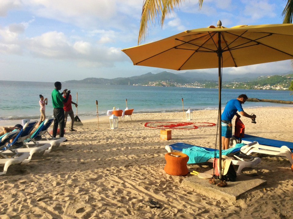 Clearing the beach for the private beachside-waterfront-sunset, dinner for two, Mount Cinnamon Resort, St. George's, Grenada
