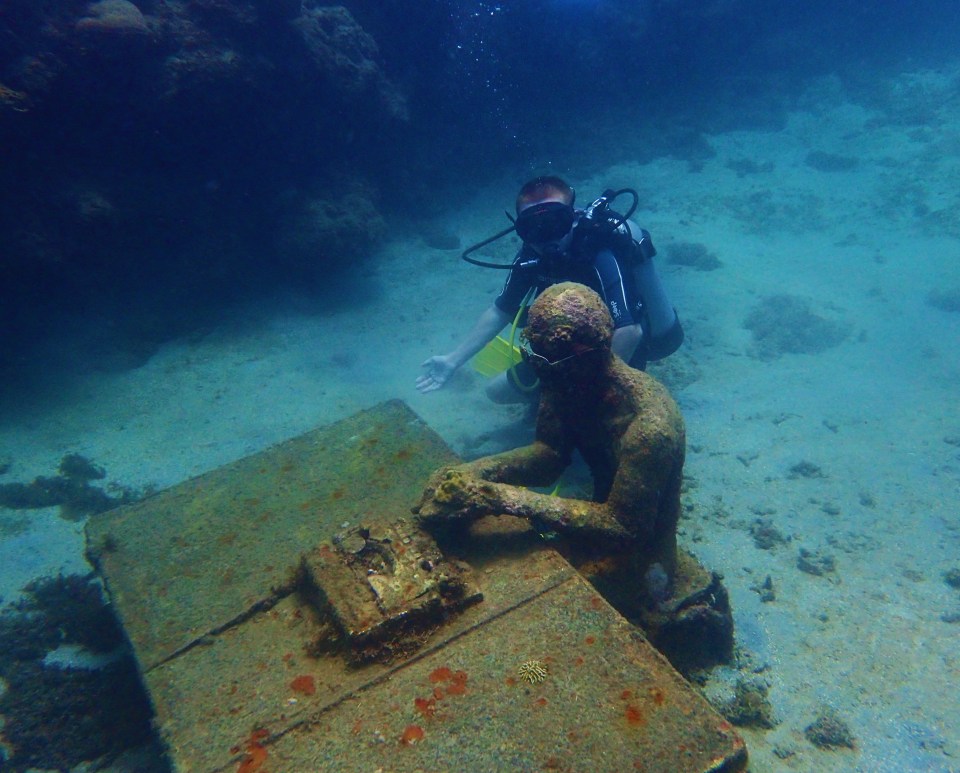 (Ryan) Typing at the desk, underwater sculpture park, Molinere Bay, Grenada