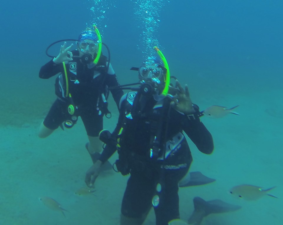 Theresa & dive buddy, Dwight, diving in St. Lucia (2017)