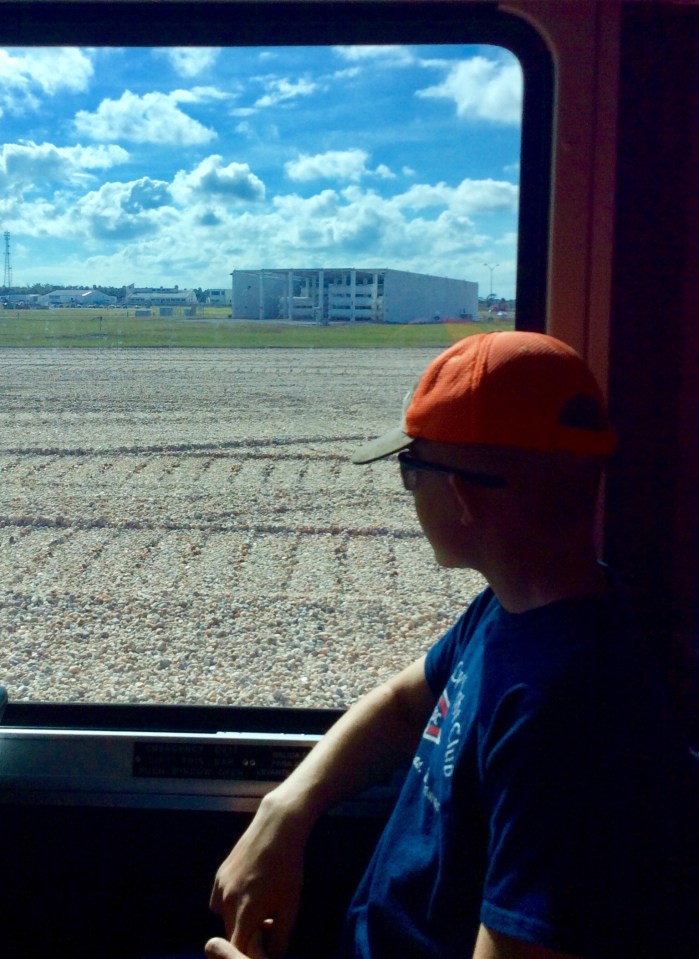 Ryan looking out on the “Crawler Space Shuttle (1 mi/hr) track,” Kennedy Space Center, Cape Canaveral, FL, 12-17