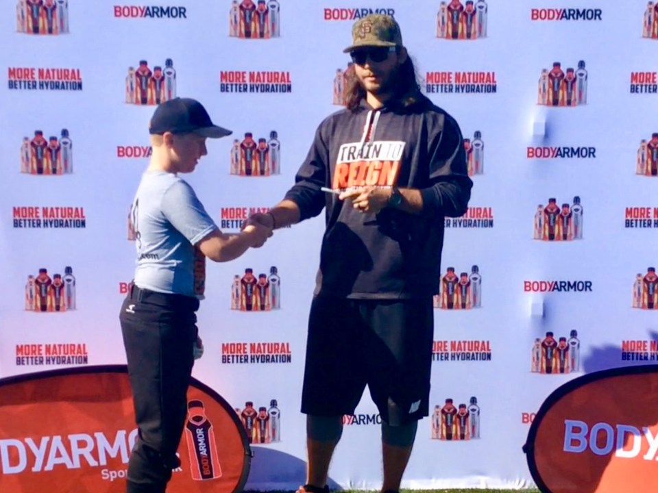 Ronan shaking hands with Brandon Crawford (Jan. 2018)