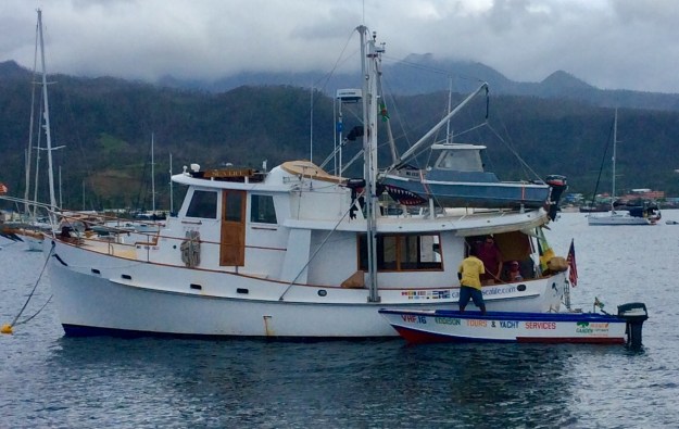 PAYS member offering services (tours, food, beverages, trash removal) to cruiser, Portsmouth, Dominica