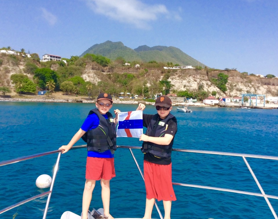 Ryan & Ronan hoisting courtesey Statia flag (March 2015)
