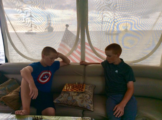 Ronan & Ryan playing chess on the bridge, Sailing Cruise Ship Club Med 2 off our stern, Deshaies, Guadeloupe (2018)