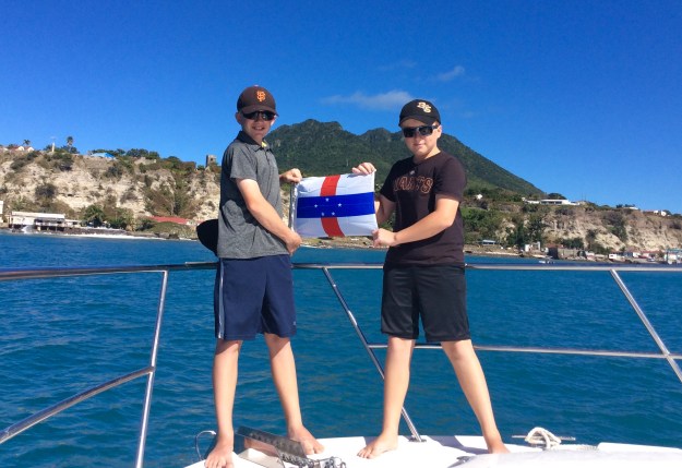Ryan & Ronan hoisting courtesey Statia flag (March 2018)