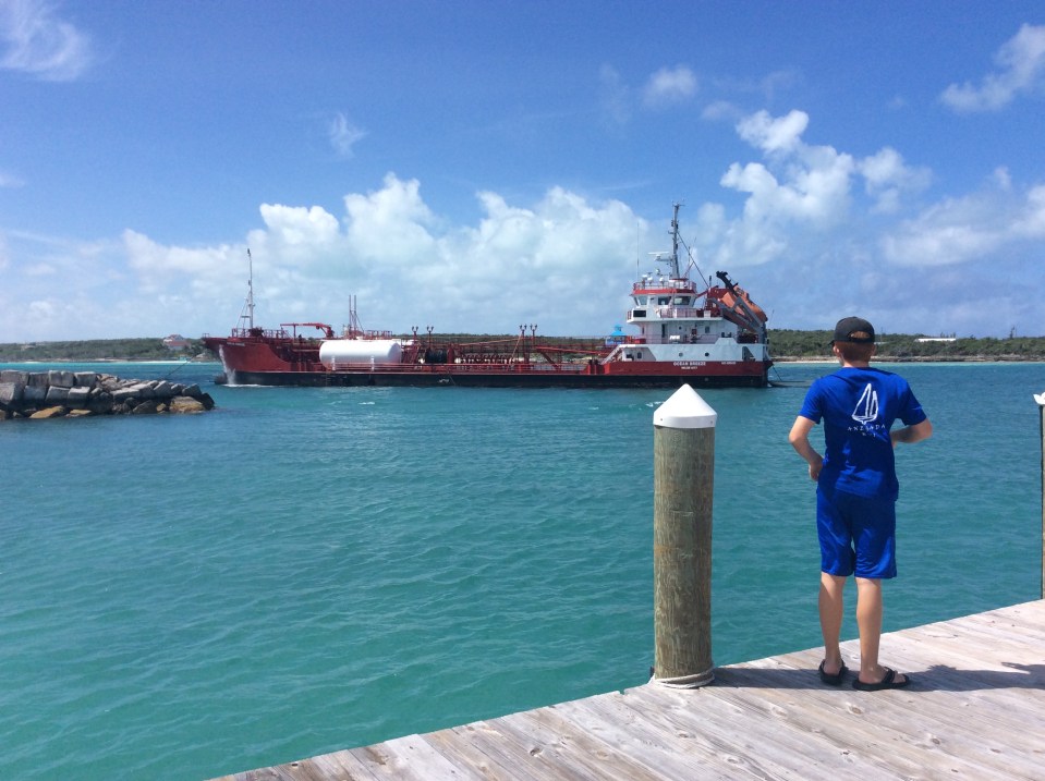 Ryan watching the fueling ship at Flying Fish Marina, Long Island, Bahamas