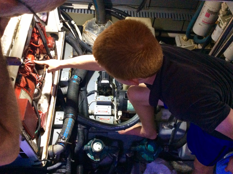 Ryan pointing to the old oil filter