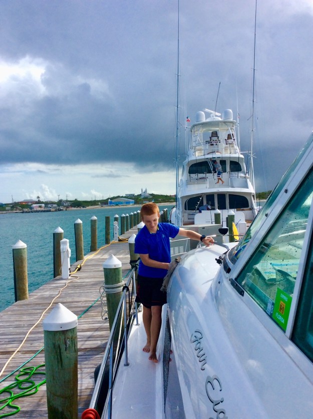 Ryan washing the salt off the boat, Flying Fish Marina, Long Island, Bahamas