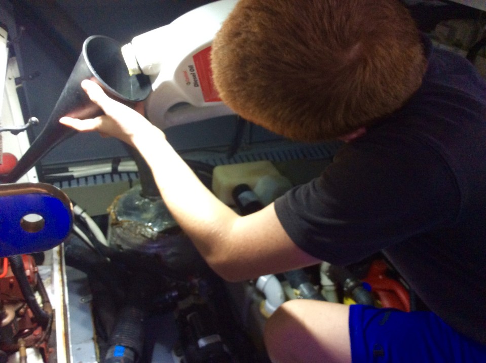 With funnel securely in oil input valve, pour in new diesel oil