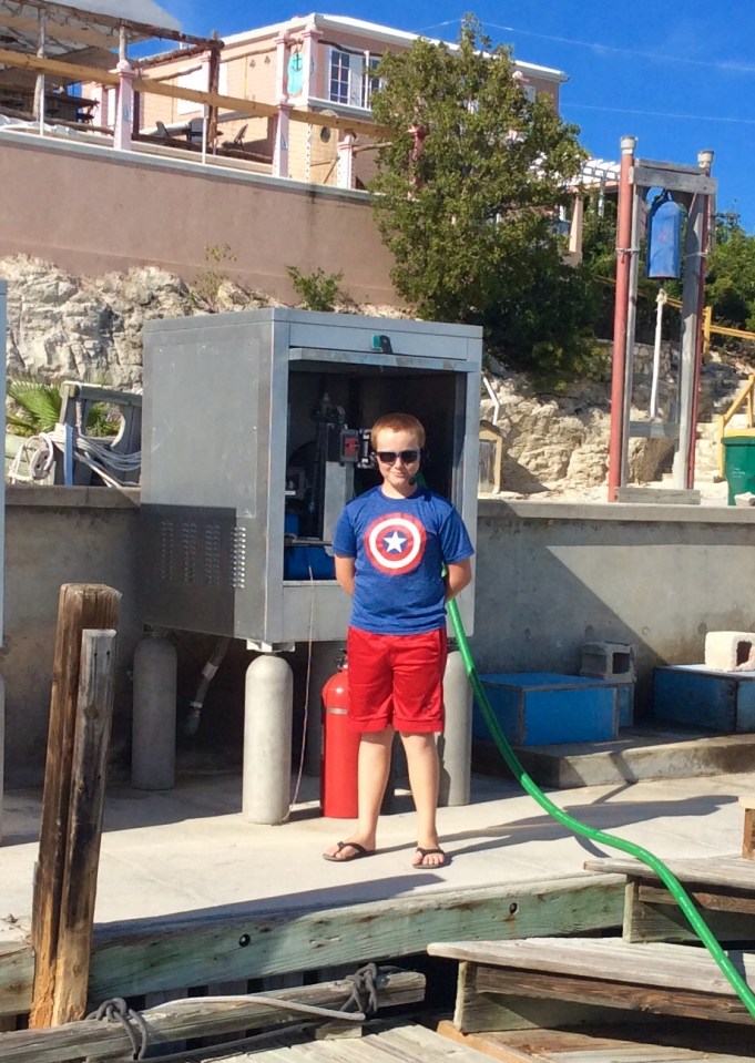 Ronan assisting with the fueling at Southside Marina, Providenciales Turks & Caicos
