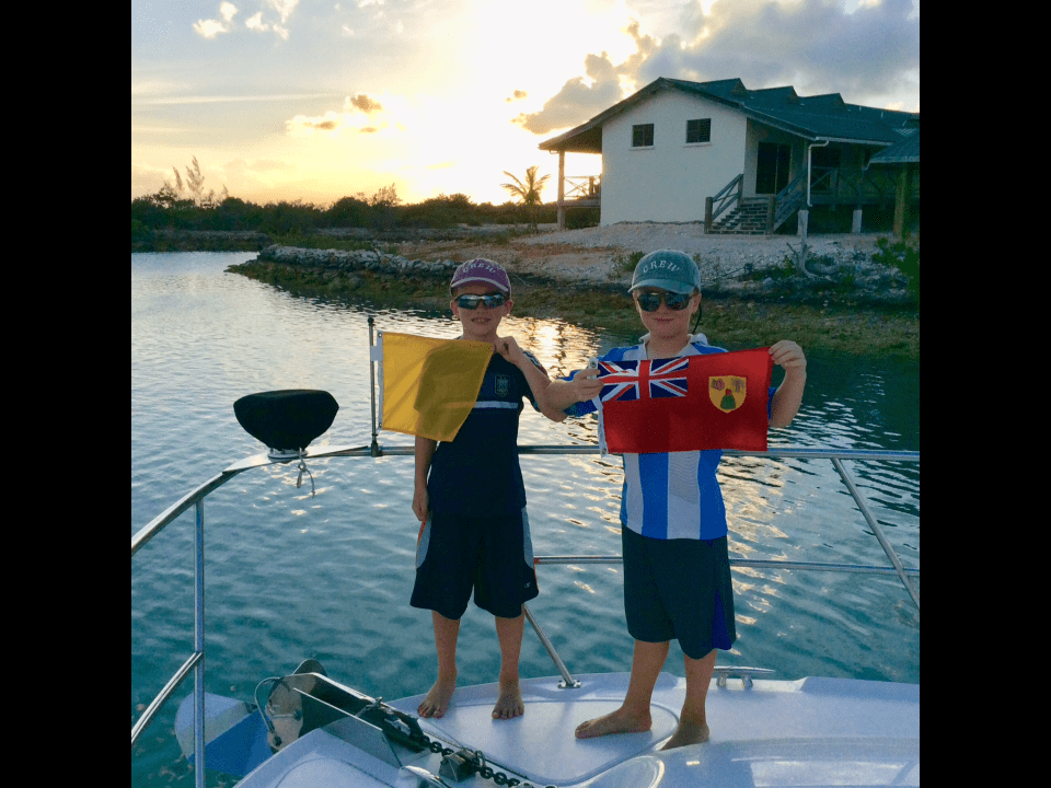 Ryan & Ronan hoisting the Turks & Caicos courtesey flag (2018)