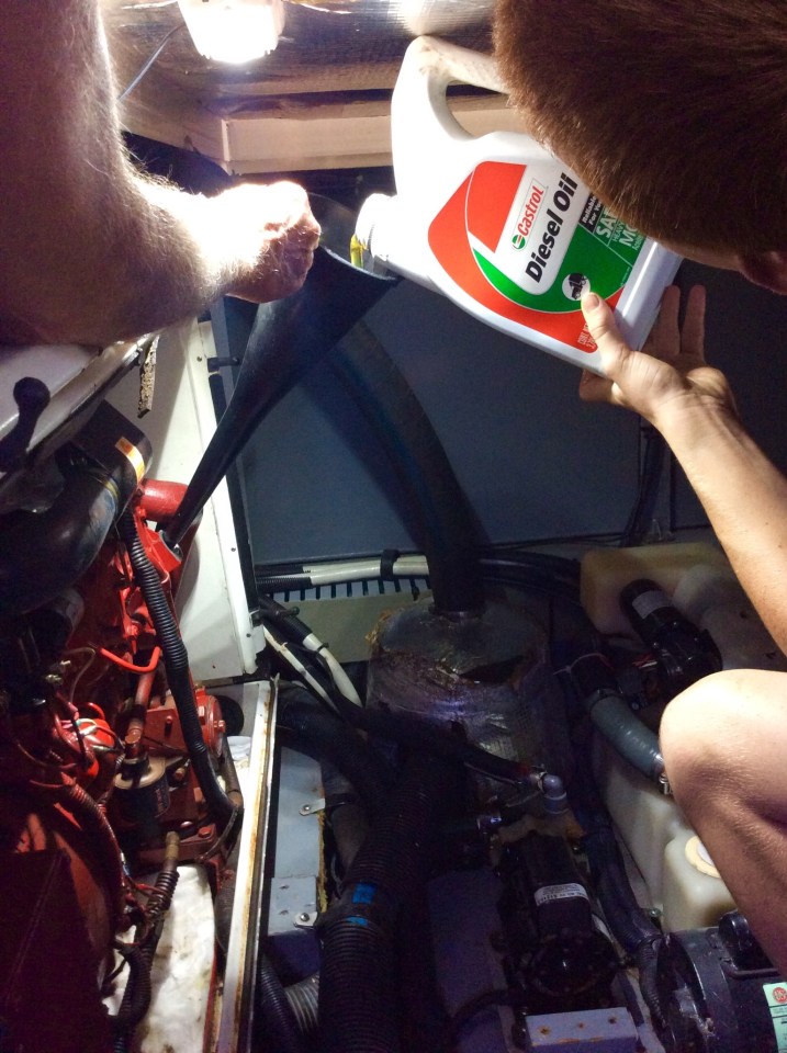 With funnel secure in oil input valve, add Diesel Oil