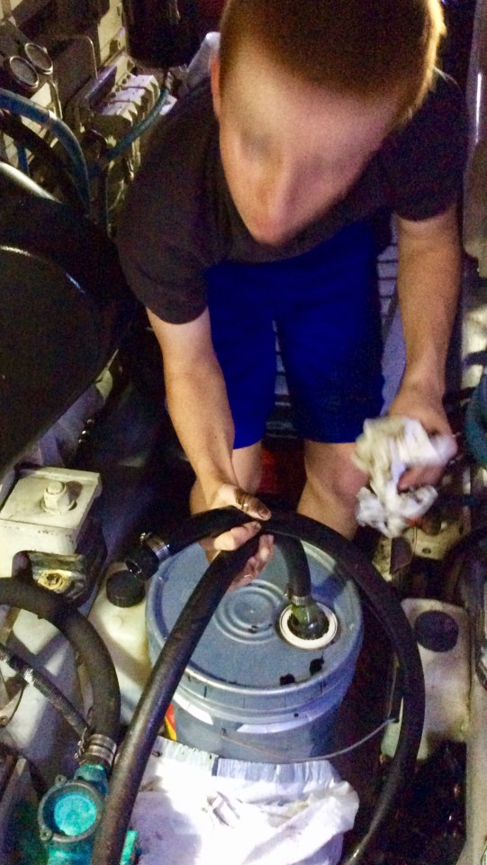 Ryan disconnecting the oil pump hose